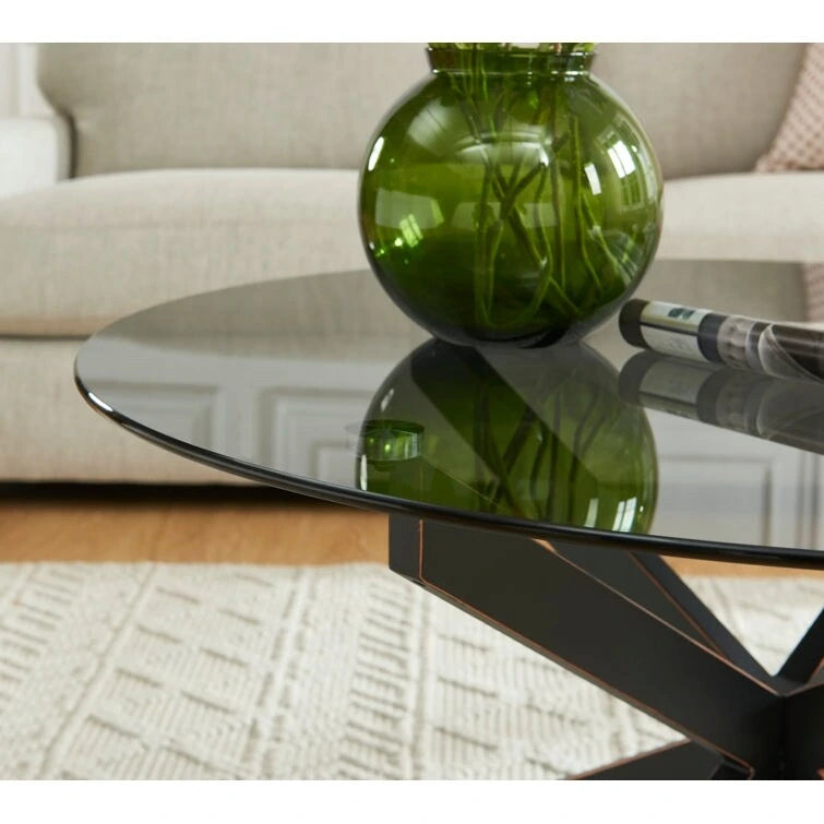 Table basse ronde en verre trempé avec pieds tubulaires en métal